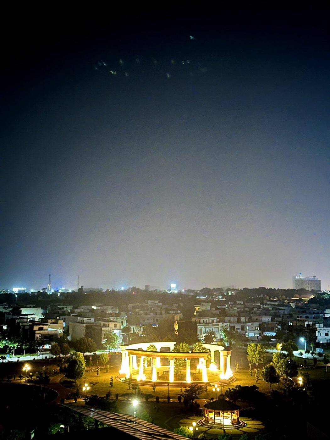 Family park near MBA Real Estate building at night